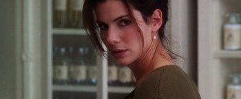 Movie still from “Practical Magic” (1998), directed by Griffin Dunne – A person wearing a sweater; Close Up shot, Over the shoulder angle