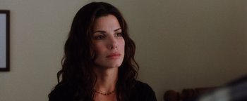 Movie still from “Practical Magic” (1998), directed by Griffin Dunne – A person with long hair; Close Up shot, Over the shoulder angle