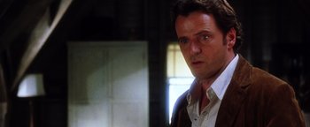 Movie still from “Practical Magic” (1998), directed by Griffin Dunne – A person wearing a shirt and jacket; Close Up shot, Low angle