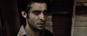 Movie still from “Practical Magic” (1998), directed by Griffin Dunne – A person wearing a shirt; Close Up shot, Over the shoulder angle