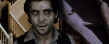 Movie still from “Practical Magic” (1998), directed by Griffin Dunne – A person wearing a shirt and vest; Close Up shot, Low angle