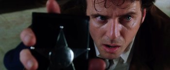 Movie still from “Practical Magic” (1998), directed by Griffin Dunne – A person holding a cell phone; Close Up shot, Low angle