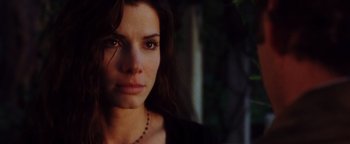 Movie still from “Practical Magic” (1998), directed by Griffin Dunne – A person wearing a necklace; Close Up shot, Low angle