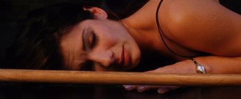 Movie still from “Practical Magic” (1998), directed by Griffin Dunne – A person laying on the ground; Close Up shot, Overhead angle