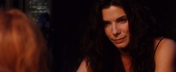 Movie still from “Practical Magic” (1998), directed by Griffin Dunne – A person with long dark hair; Close Up shot, High angle