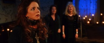 Movie still from “Practical Magic” (1998), directed by Griffin Dunne – Three women are standing in front of each other; Close Up shot, Low angle