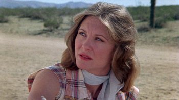 Movie still from “The Hills Have Eyes” (1977), directed by Wes Craven – A person wearing a plaid shirt; Close Up shot, Low angle