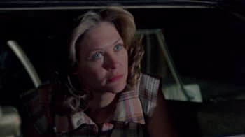 Movie still from “The Hills Have Eyes” (1977), directed by Wes Craven – A person sitting in a car; Close Up shot, Over the shoulder angle