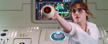 Movie still from “The Hitchhiker's Guide to the Galaxy” (2005), directed by Garth Jennings – A young boy holding a video game controller in front of a computer screen; Close Up shot, Over the shoulder angle
