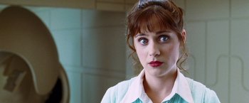 Movie still from “The Hitchhiker's Guide to the Galaxy” (2005), directed by Garth Jennings – A person wearing a dress shirt; Close Up shot, Over the shoulder angle