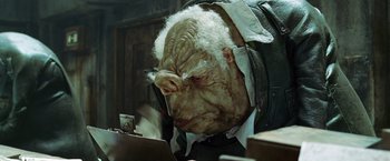 Movie still from “The Hitchhiker's Guide to the Galaxy” (2005), directed by Garth Jennings – An old man with a strange look on his face; Close Up shot, Low angle
