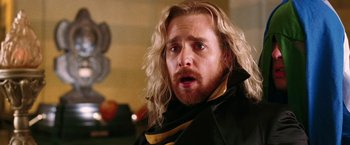 Movie still from “The Hitchhiker's Guide to the Galaxy” (2005), directed by Garth Jennings – A person with long blonde hair; Close Up shot, Low angle