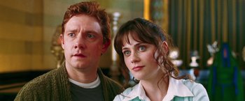 Movie still from “The Hitchhiker's Guide to the Galaxy” (2005), directed by Garth Jennings – A man and a woman standing next to each other; Close Up shot, Over the shoulder angle