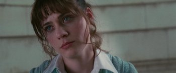 Movie still from “The Hitchhiker's Guide to the Galaxy” (2005), directed by Garth Jennings – A person wearing a blue shirt; Close Up shot, Over the shoulder angle