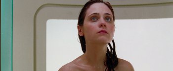 Movie still from “The Hitchhiker's Guide to the Galaxy” (2005), directed by Garth Jennings – A woman with wet hair and blue eyes looking upward; Close Up shot, Low angle