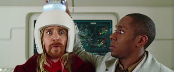 Movie still from “The Hitchhiker's Guide to the Galaxy” (2005), directed by Garth Jennings – A man with a helmet on his head and another man with a helmet on his head; Close Up shot, Over the shoulder angle
