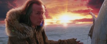 Movie still from “The Hitchhiker's Guide to the Galaxy” (2005), directed by Garth Jennings – A man in a fur coat looking into the distance at sunset; Close Up shot, Over the shoulder angle