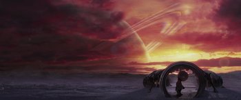 Movie still from “The Hitchhiker's Guide to the Galaxy” (2005), directed by Garth Jennings – An image of an image of a sunset in the background; Extreme Wide shot, Low angle