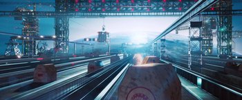 Movie still from “The Hitchhiker's Guide to the Galaxy” (2005), directed by Garth Jennings – A view of a train station from a train window; Extreme Wide shot, Overhead angle