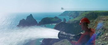 Movie still from “The Hitchhiker's Guide to the Galaxy” (2005), directed by Garth Jennings – A view from a helicopter looking at the ocean; Extreme Wide shot, Low angle