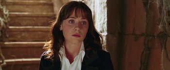 Movie still from “The Hitchhiker's Guide to the Galaxy” (2005), directed by Garth Jennings – A person wearing a suit and tie; Close Up shot, Over the shoulder angle