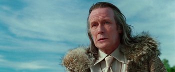 Movie still from “The Hitchhiker's Guide to the Galaxy” (2005), directed by Garth Jennings – An older man with long hair and a beard; Close Up shot, Low angle