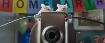 Movie still from “The Hitchhiker's Guide to the Galaxy” (2005), directed by Garth Jennings – Two white mice sitting on top of each other; Extreme Close Up shot, Low angle