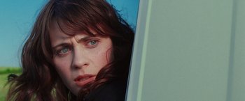 Movie still from “The Hitchhiker's Guide to the Galaxy” (2005), directed by Garth Jennings – A person with long hair; Close Up shot, High angle