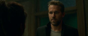 Movie still from “The Hitman's Bodyguard” (2017), directed by Patrick Hughes – A person wearing a jacket; Close Up shot, Over the shoulder angle