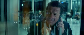 Movie still from “The Hitman's Bodyguard” (2017), directed by Patrick Hughes – A person talking on a cell phone; Close Up shot, Over the shoulder angle