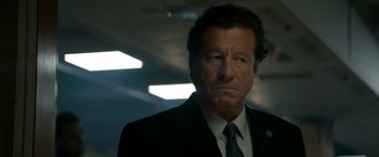 Movie still from “The Hitman's Bodyguard” (2017), directed by Patrick Hughes – A person wearing a suit and tie; Close Up shot, Low angle