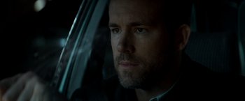 Movie still from “The Hitman's Bodyguard” (2017), directed by Patrick Hughes – A person in a car; Close Up shot, Low angle
