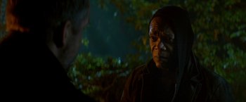 Movie still from “The Hitman's Bodyguard” (2017), directed by Patrick Hughes – A man in a brown shirt is talking to another man; Close Up shot, Over the shoulder angle