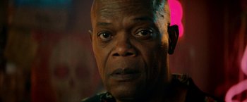 Movie still from “The Hitman's Bodyguard” (2017), directed by Patrick Hughes – An older man is looking into the camera; Close Up shot, Low angle