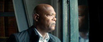 Movie still from “The Hitman's Bodyguard” (2017), directed by Patrick Hughes – An older man looking out of a window; Close Up shot, Low angle