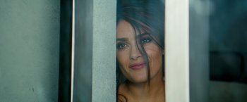 Movie still from “The Hitman's Bodyguard” (2017), directed by Patrick Hughes – A woman's face looking through a window; Close Up shot, Overhead angle