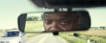 Movie still from “The Hitman's Bodyguard” (2017), directed by Patrick Hughes – A person's eyes in a car mirror; Close Up shot, Over the shoulder angle
