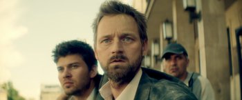 Movie still from “The Hitman's Bodyguard” (2017), directed by Patrick Hughes – A person with a beard; Close Up shot, Low angle