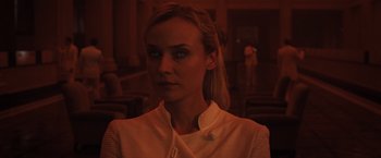 Movie still from “The Host” (2013), directed by Andrew Niccol – A woman in a white shirt is looking at the camera; Close Up shot, Over the shoulder angle