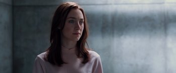 Movie still from “The Host” (2013), directed by Andrew Niccol – A woman with long brown hair wearing a pink shirt; Close Up shot, Over the shoulder angle