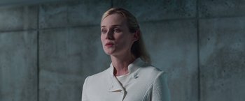 Movie still from “The Host” (2013), directed by Andrew Niccol – A woman in a white jacket standing in front of a concrete wall; Close Up shot, Low angle