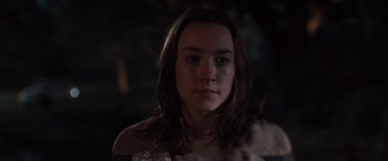 Movie still from “The Host” (2013), directed by Andrew Niccol – A woman with long brown hair stares into the camera; Close Up shot, Over the shoulder angle