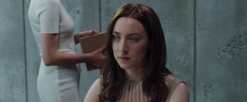 Movie still from “The Host” (2013), directed by Andrew Niccol – A young woman getting her hair dried by a stylist; Close Up shot, Over the shoulder angle