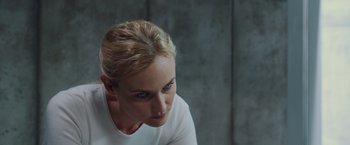 Movie still from “The Host” (2013), directed by Andrew Niccol – A woman in a white shirt is looking at the camera; Close Up shot, Over the shoulder angle