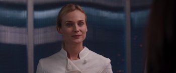 Movie still from “The Host” (2013), directed by Andrew Niccol – A person wearing a white jacket; Close Up shot, Over the shoulder angle