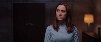 Movie still from “The Host” (2013), directed by Andrew Niccol – A woman with long brown hair wearing a light blue shirt; Close Up shot, Low angle