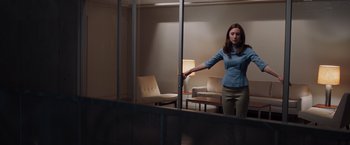 Movie still from “The Host” (2013), directed by Andrew Niccol – A woman standing in front of a mirror in a room; Wide shot, Low angle