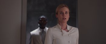 Movie still from “The Host” (2013), directed by Andrew Niccol – A woman standing next to a man wearing a suit; Medium shot, Over the shoulder angle