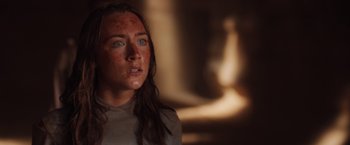 Movie still from “The Host” (2013), directed by Andrew Niccol – A person with red spots on their face; Close Up shot, Over the shoulder angle