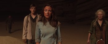 Movie still from “The Host” (2013), directed by Andrew Niccol – A young woman and a young man standing next to each other; Medium shot, Over the shoulder angle